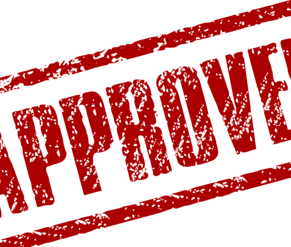 Das Bild zeigt einen Stempelabdruck mit der Aufschrift "Approved".